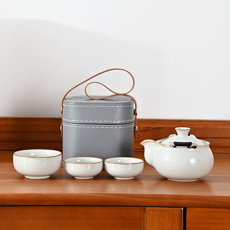 Ru kiln twisted branch lotus, a pot of three cups of travel tea set, a complete set of express cup outdoor portable bag, brewing teapot