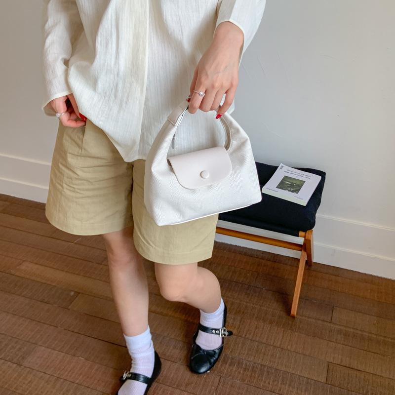 Lässige Tasche Damen Sommer neue Mode Nischendesign Umhängetasche tragbare Knödeltasche