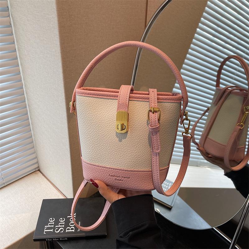

Niche portable bucket bag women s new spring and summer versatile shoulder bag commuter messenger bag рожевий