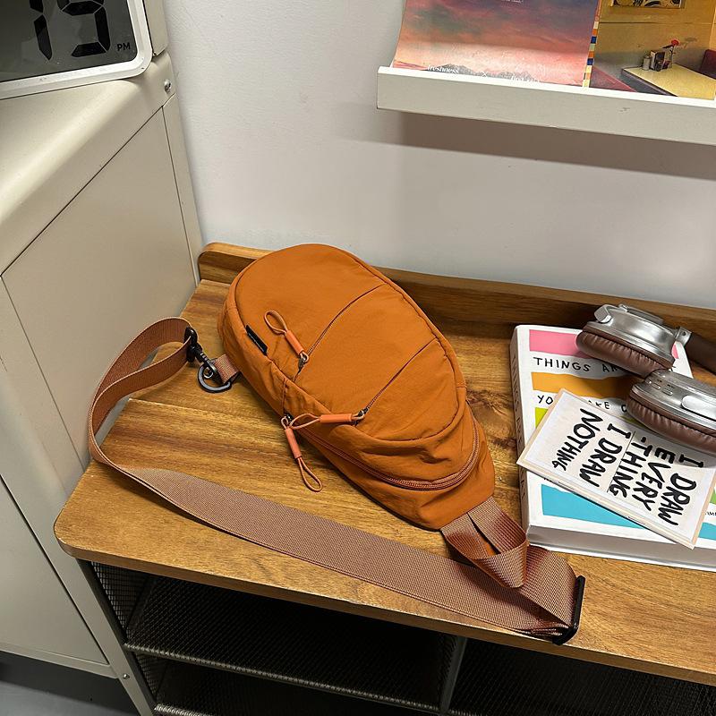 

Breast bag Men s ISN trendy brand solid color messenger bag Casual versatile high-end shoulder bag Multifunctional commuter mobile phone bag помаранчевий
