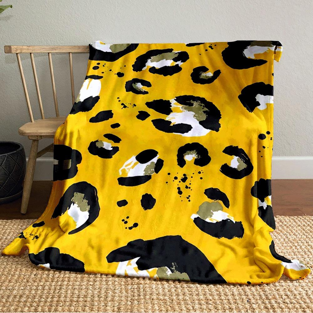 Abstract leopard print with black, white, and olive spots on yellow. for all seasons blanket lunch break throw gift
