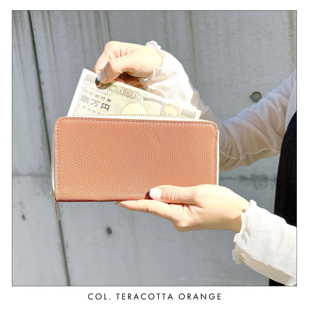 Genuine leather long wallet for men and women in natural ivory. Features a round zipper closure, coin purse, and card slots.