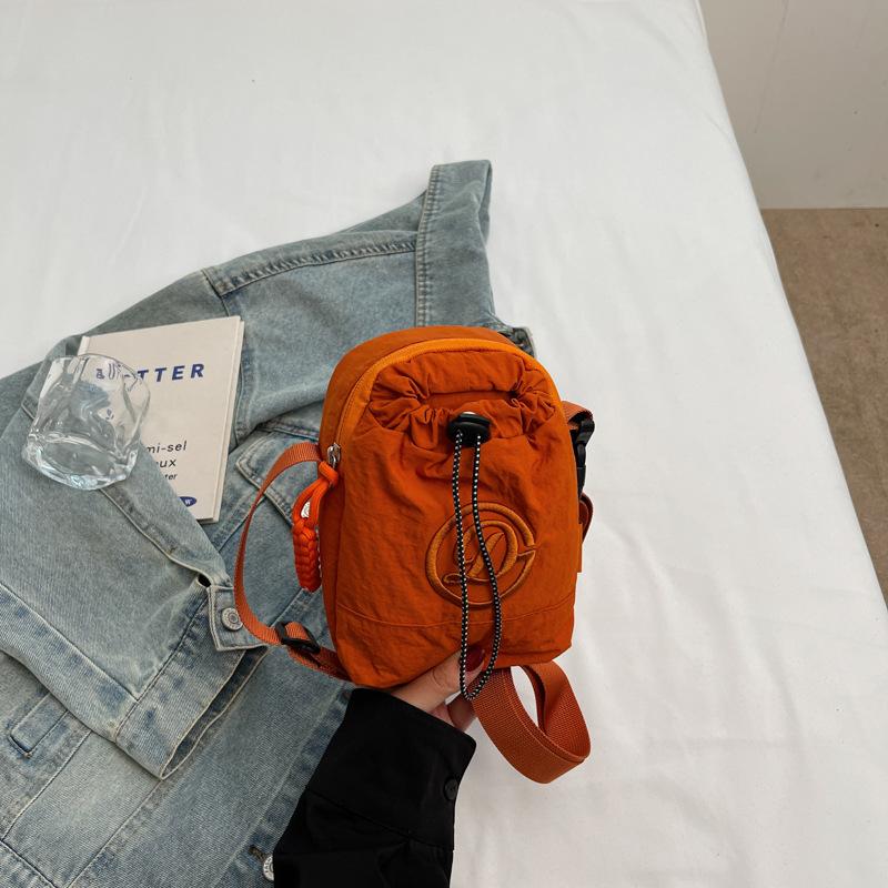 Mobile phone water cup integrated bag kettle bag Japanese women solid color shoulder bag commuter small satchel light travel bag