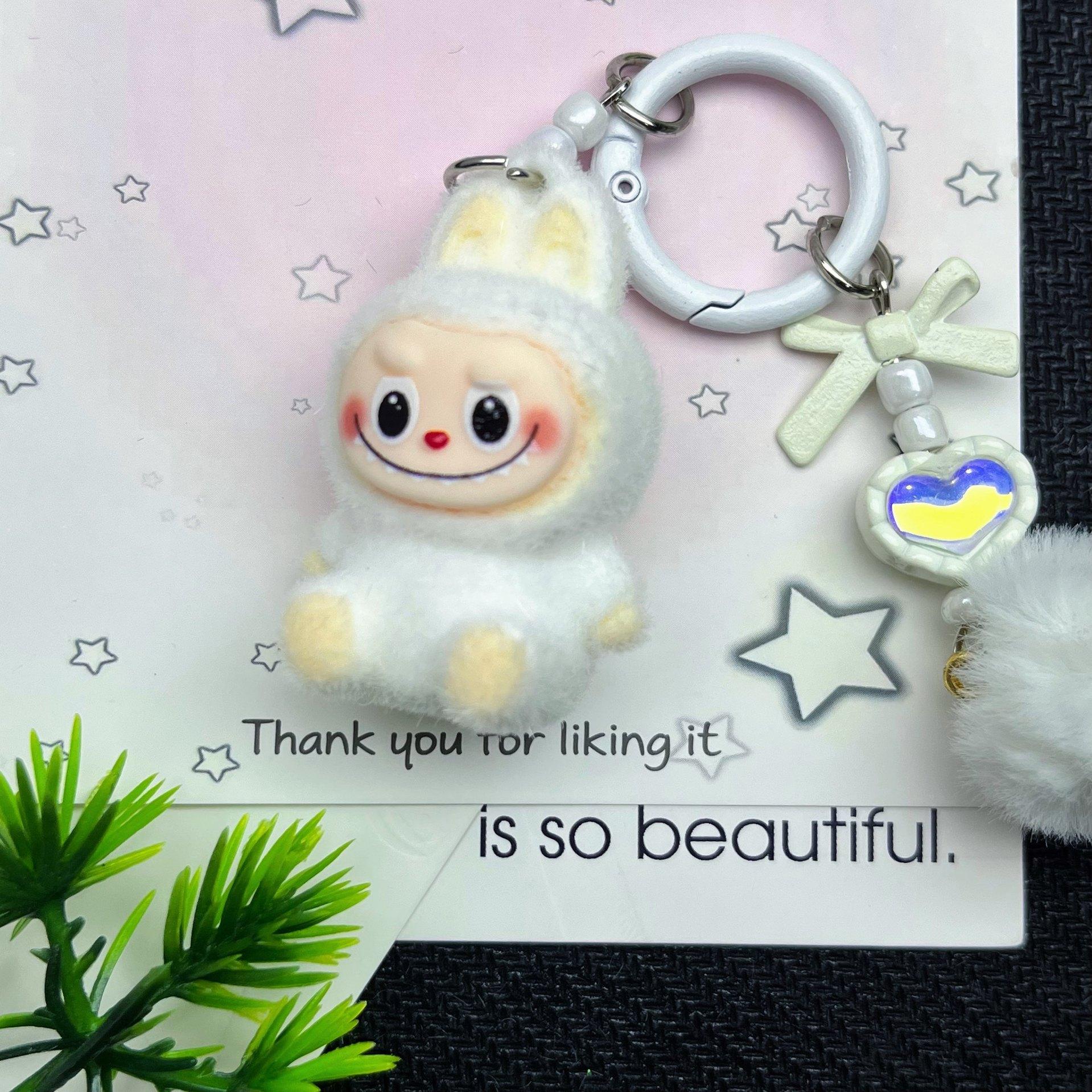 

Флокированный сидячий брелок Одиночная кукла Сделай сам Милые зерновые аксессуары Мягкий клей Милый зерновой малыш Сумка для прогулок Подвеска для мобильного телефона