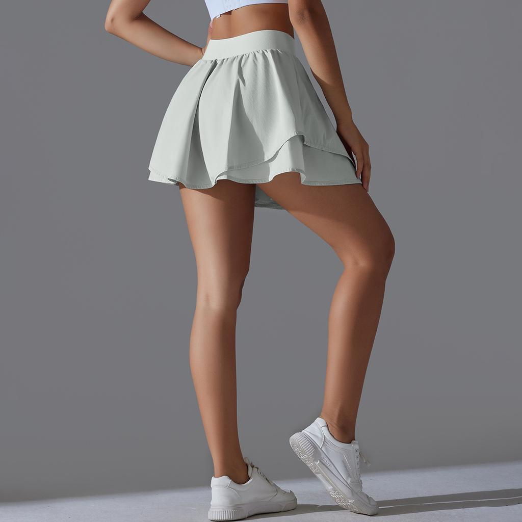 Jupe de tennis à double poche de couleur unie, short de sport élastique serré et sexy pour course à pied, fitness, yoga pour femmes