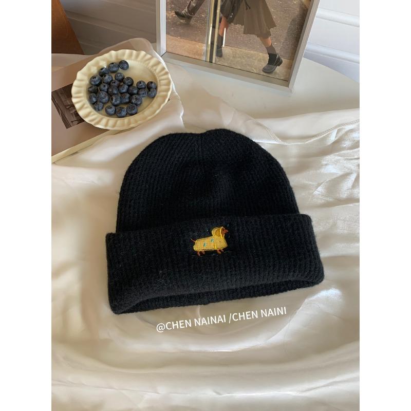 Embroidered Woolen Caps Are Cute for Children In Autumn and Winter. They Are Small Knitted Caps with Big Heads That Show Off Their Faces