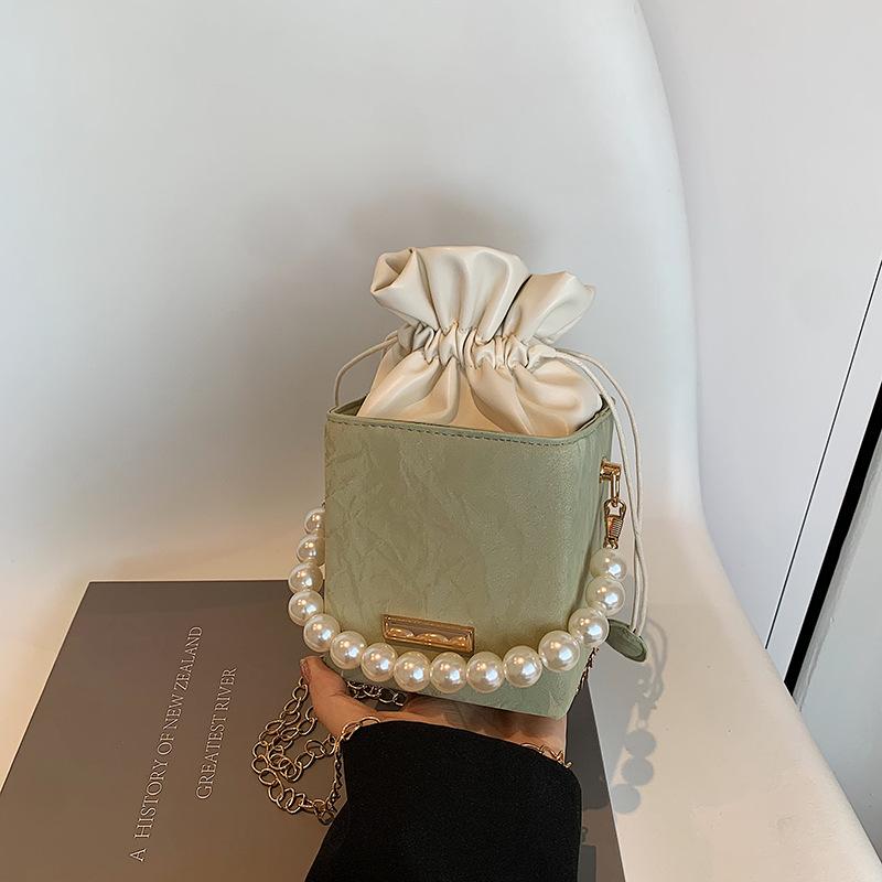 

Summer small bag 2025 new casual and beautiful bucket bag casual simple messenger bag pearl portable women s bag зелёный