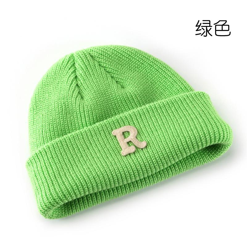 Women's Solid Color Letter Print R Rolled brim knitted hat for outdoor cycling, providing warmth, cold protection, and ear coverage