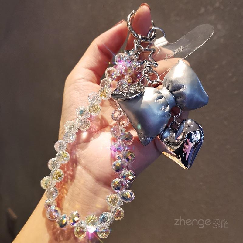 Small fragrance bow tie, love mobile phone hanging chain, ins mobile phone case, pendant, beaded chain, short fashion women's wrist ornament