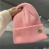 Cute smiley face label wool hat women's autumn and winter warm trend versatile ear protector black knitted hat men