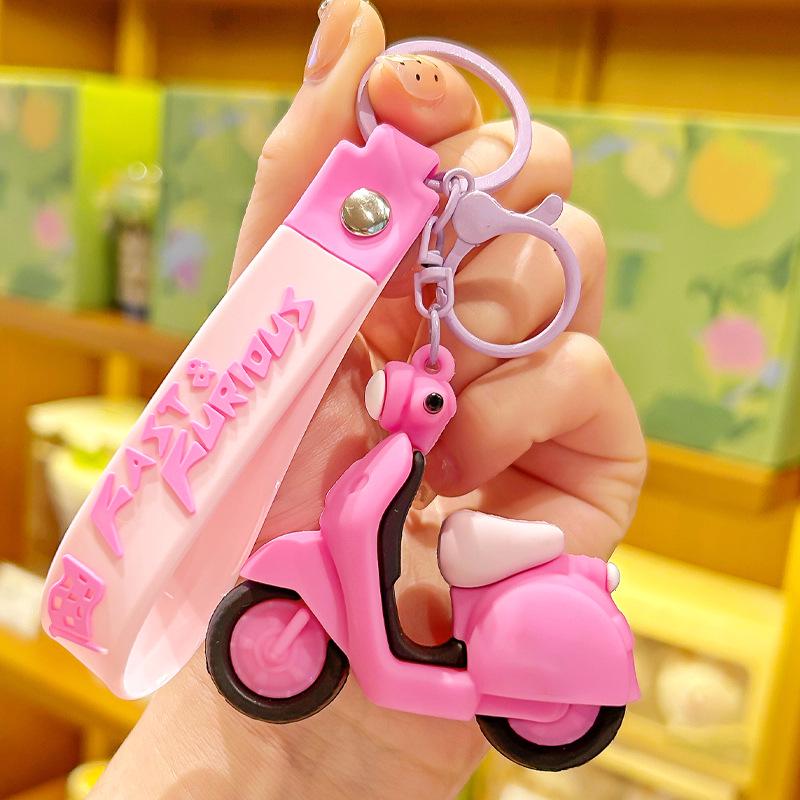 Creative Cartoon Car Keychain: Soft Rubber Pendant for Backpack or Bag.