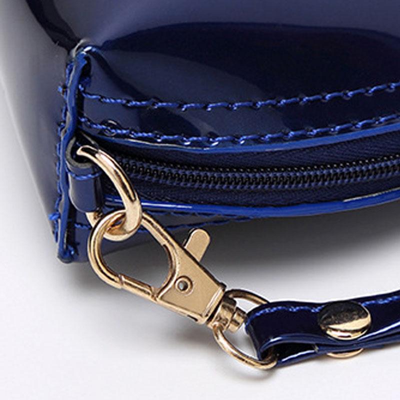 IELGY Ruka držící červené brýle Módní mobilní telefon Univerzální neformální dámská taška Malá změna