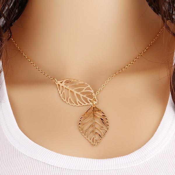 

Korean fashion trend wild forest-based metal leaf pendant necklace clavicle short section of double-leaf Zircon free shipping золотой