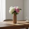 A modern vase with simple lines, elegant brown with a delicate pattern