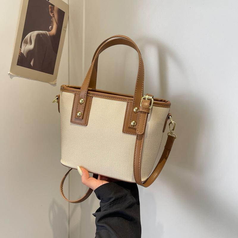 Autumn new fashionable and simple contrasting color vegetable basket bag portable shoulder oblique span trendy women's bag