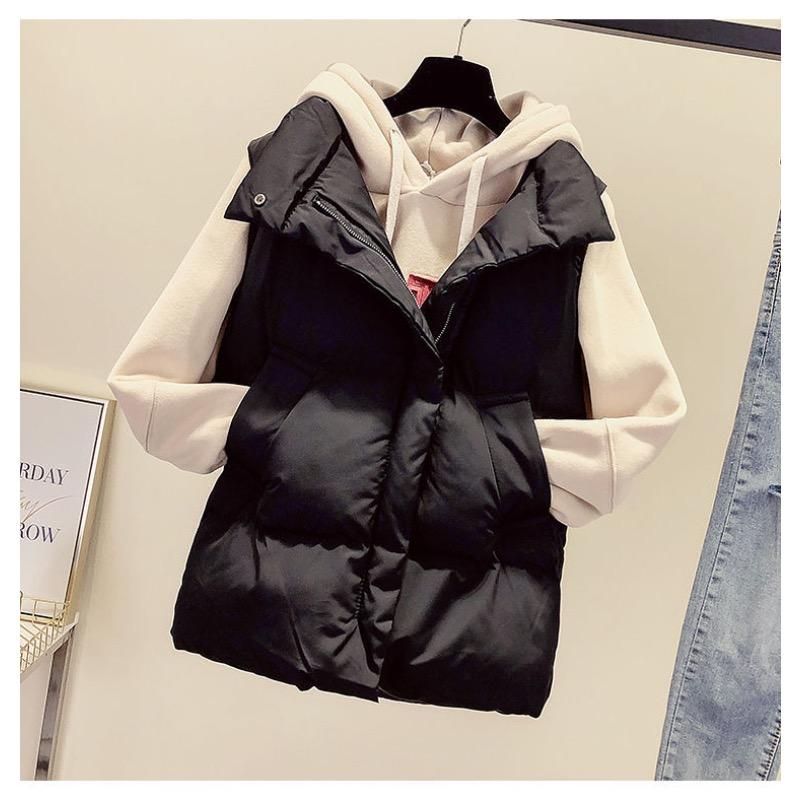 Women Wearing Vests and Jackets Outside