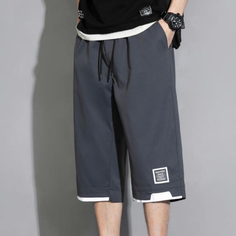 Summer Man Všestranné Ležérní šortky Koreon Streetwear Móda Pružný pas Baggy Khaki Černá Zelená Velká velikost Capri Kalhoty 8XL