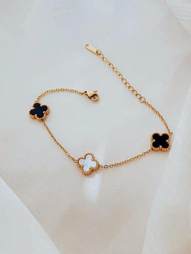 

Женский браслет из титановой стали с золотым покрытием в виде четырехлистного клевера - Черно-белый, Двусторонний, Дизайн простой роскоши