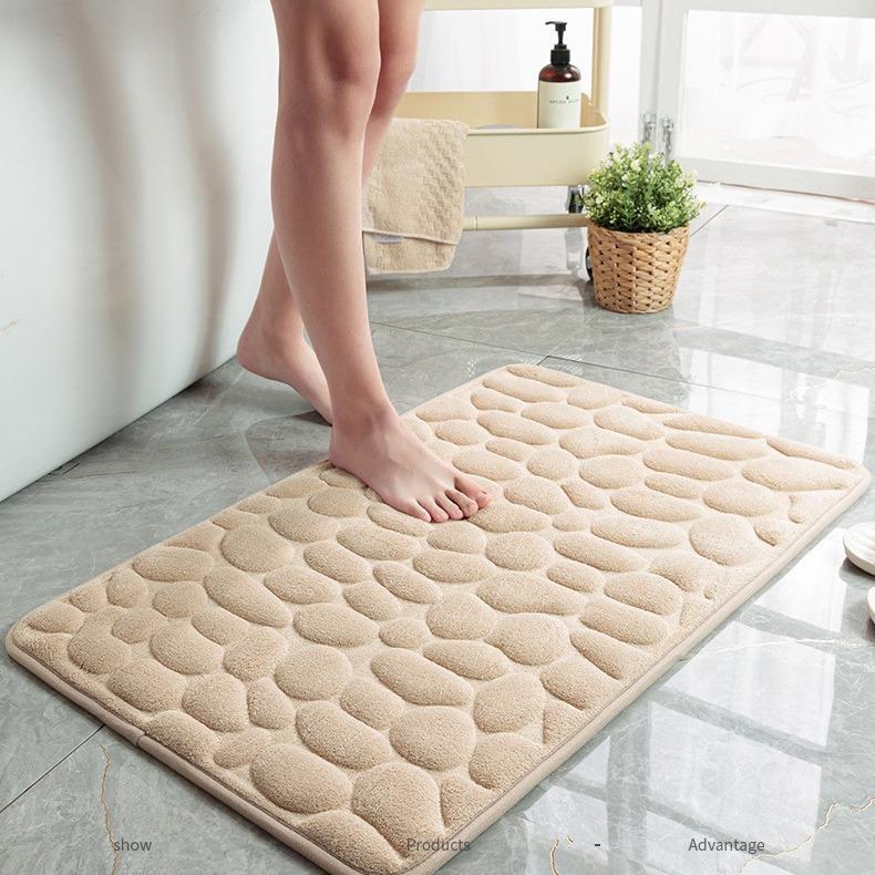 Kobercová předložka z korálového rouna s embosovaným vzorem oblázků - Minimalistická, protiskluzová, savá, prodyšná, snadno udržovatelná podložka pod nohy.