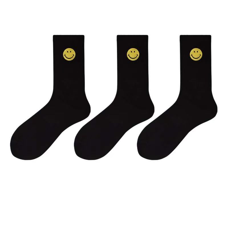 Einfarbige, mittellange Socken mit frischem, lächelndem Gesichtsmuster, schlichtem Design, bequem und atmungsaktiv.