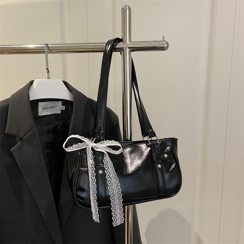 French niche bag women's new bow pillow bag shoulder messenger bag portable baguette bag