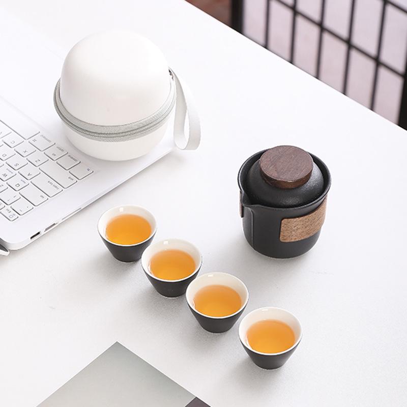 Portable Travel Tea Set: Teapot, Four Cups, and Storage Bag for Outdoor Camping.