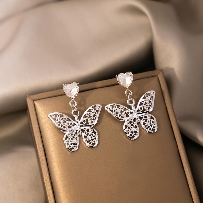 

Silver Needle Howlite Heart & Butterfly Dangle Earrings