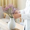 White Ceramic Vase with Dried Baby's Breath for Living Room or Dining Table Decoration