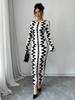 Evropské a americké podzim/zima 2025 přiléhavé šaty s černobílým potiskem, kulatým výstřihem a dlouhými rukávy