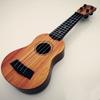 Bērnu simulācijas ukulele ģitāra mūzikas izglītībai un apgaismībai.