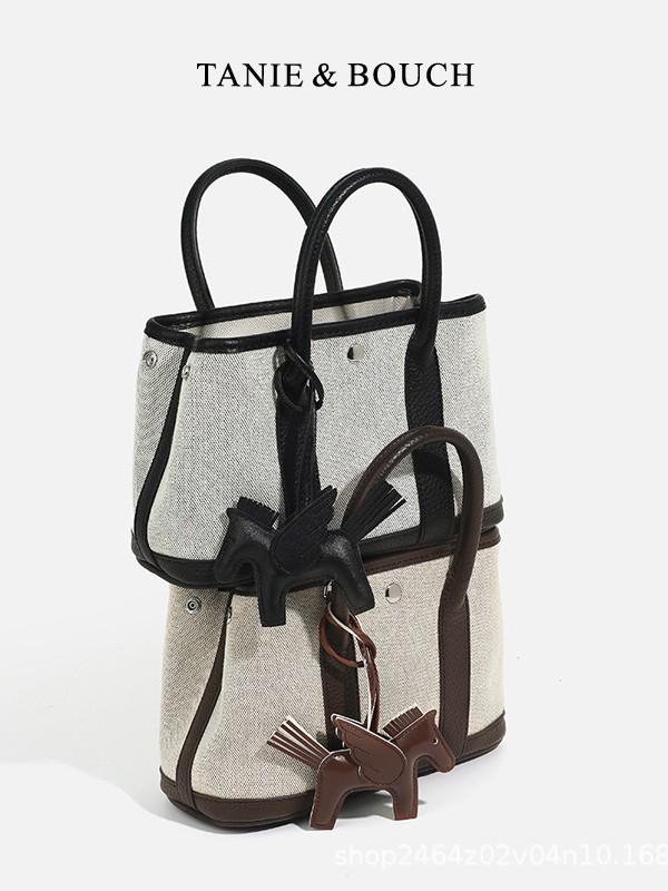 

Niche Luxury Canvas Mini Garden Handbag: Stylish, Versatile Crossbody for Women Ebony