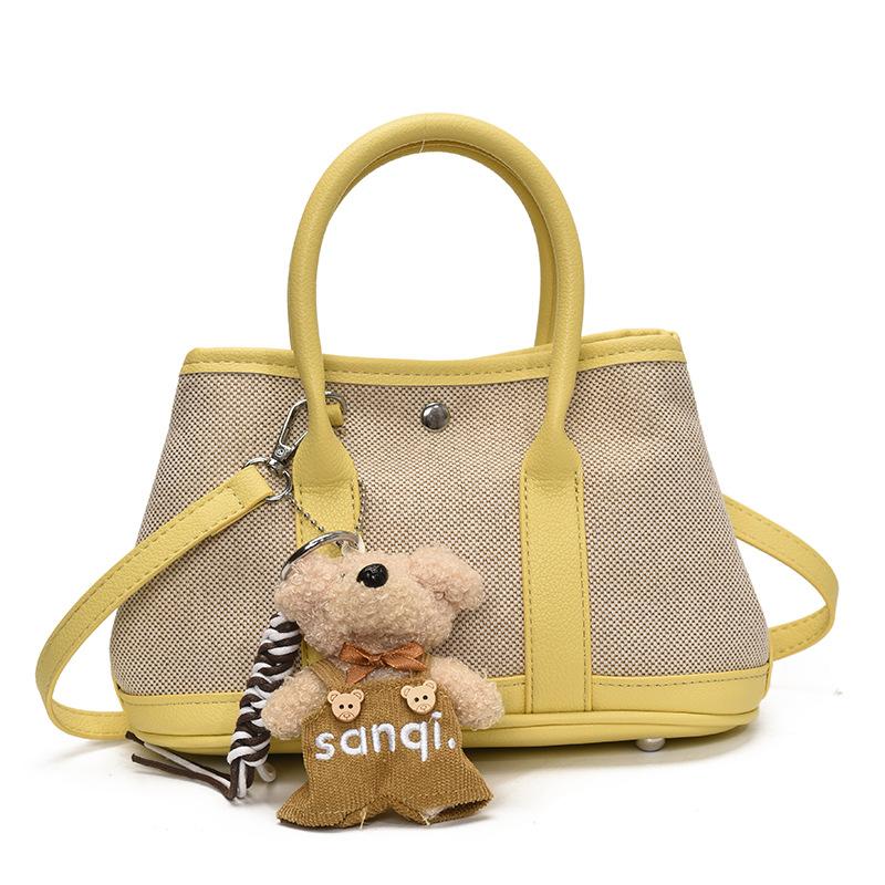 Korean version of casual niche contrasting color splicing portable bucket bag fashion versatile temperament casual commuter messenger bag woman