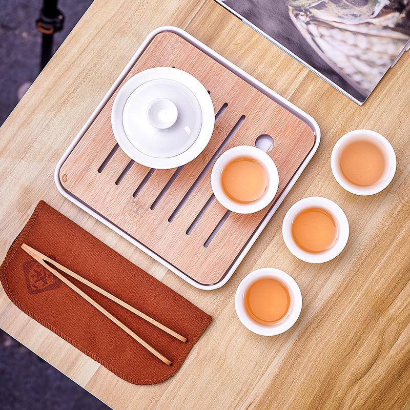 Dehua white porcelain tea set, practical ceramic cover bowl, one pot, four cups, outdoor storage, travel convenience bag, business small gifts