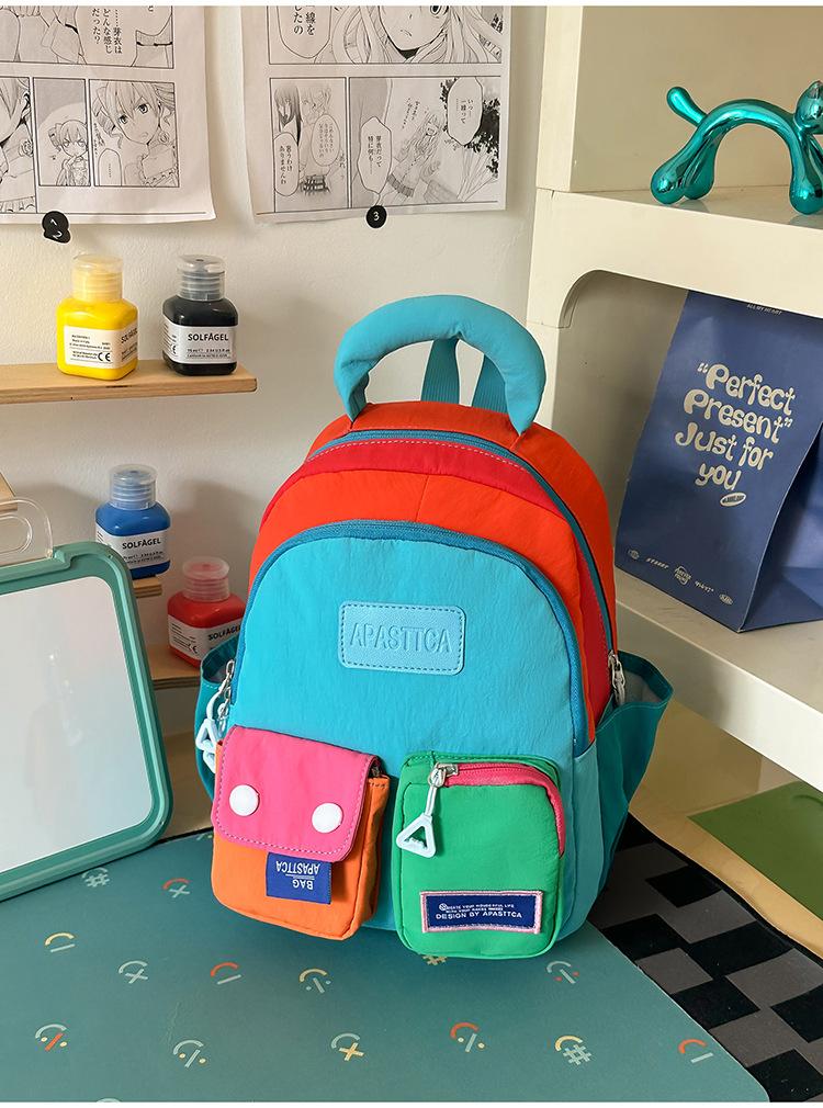 Schoolbag vitality rainbow color matching splicing backpack girl childlike dopamine wind shopping photo clock in backpack