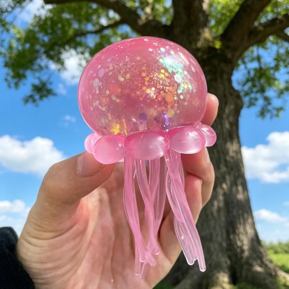 Nee Doh Jelly Squish-Super Solid Squish Stress Ball, Glitter Filled Jellyfish Fidget Toy for Anxiety Relief, Soft Squeeze Sensory Toy for Kids Adults