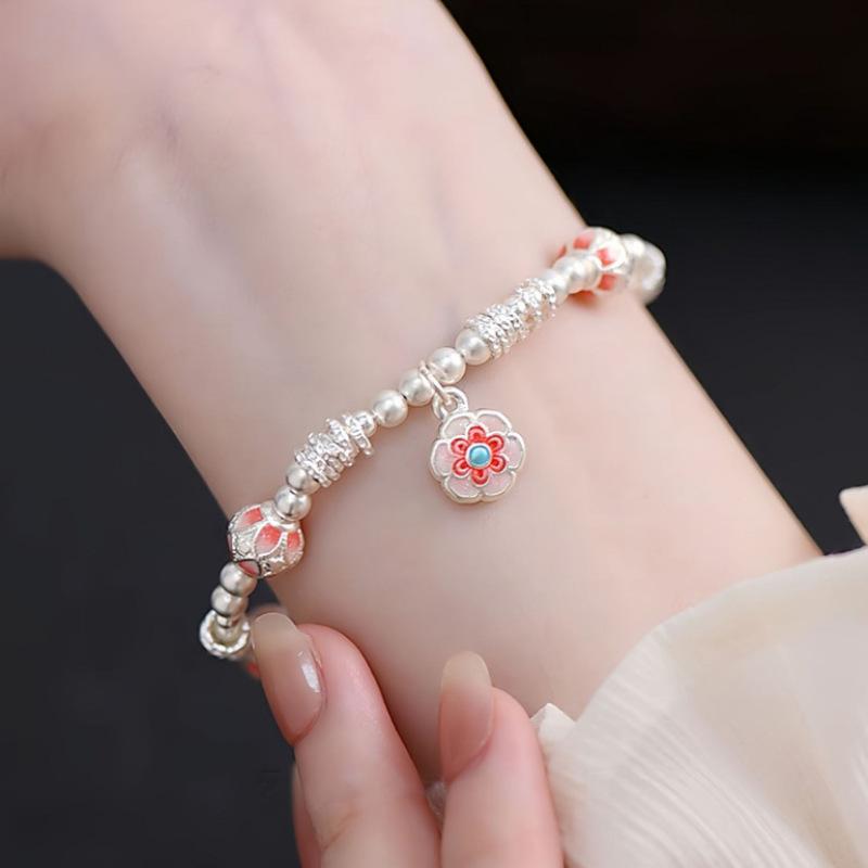Enamel color Baoxiang flower bracelet, lucky character flower ball entanglement bracelet, light luxury high-end bracelet, fashionable and versatile