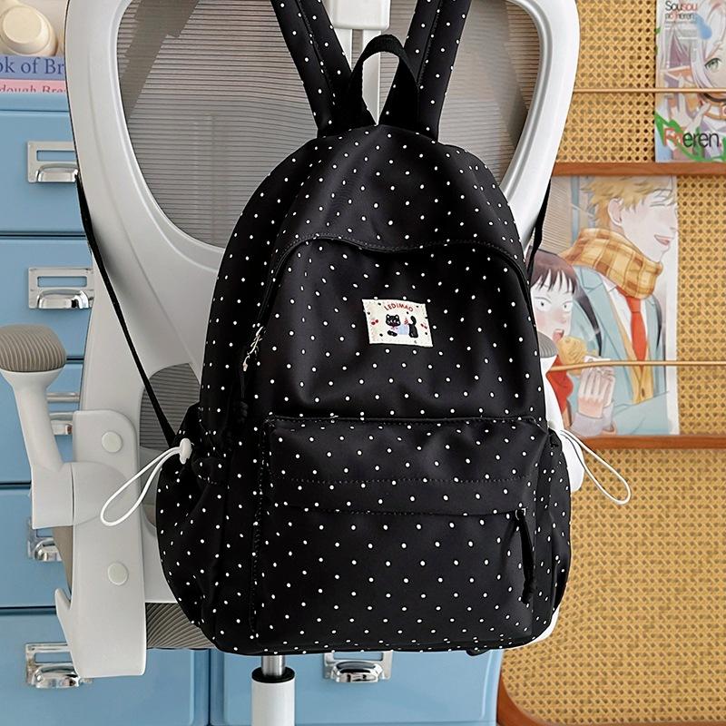 School bag: new elementary school backpack, girls' middle school students, high aesthetic value, INS style, niche, cute polka dot lightweight backpack