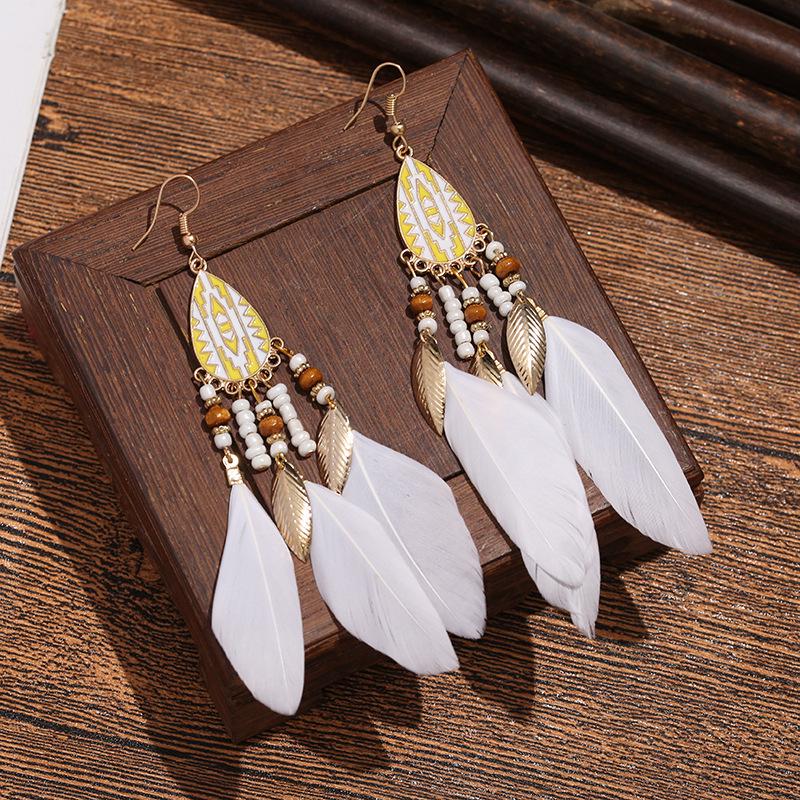 Bohemian Faux Silver Feather Tassel Mosquito Coil Earrings: Summer Retro Ethnic Ear Jewelry
