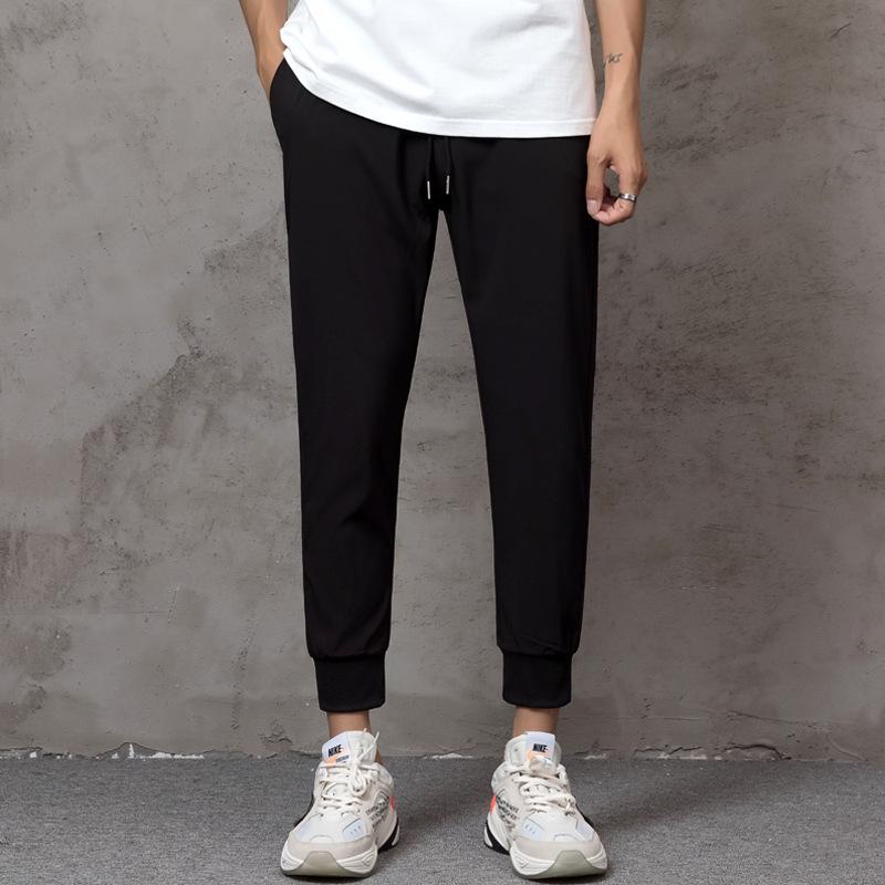 

Men s casual pants summer thin pants large size loose trend nine-point corded sweatpants loose corded feet 5XL чёрный
