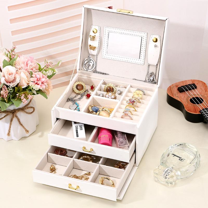 Kompakte Schmuckschatulle aus Leder mit Schloss für Ohrringe und Ohrstecker