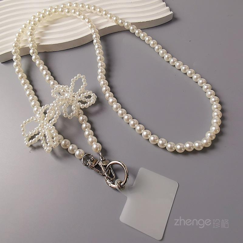 Crossbody pearl petal mobile phone lanyard women s ins shopping fashion small fragrant style long mobile phone lanyard strap chain [pearl white]