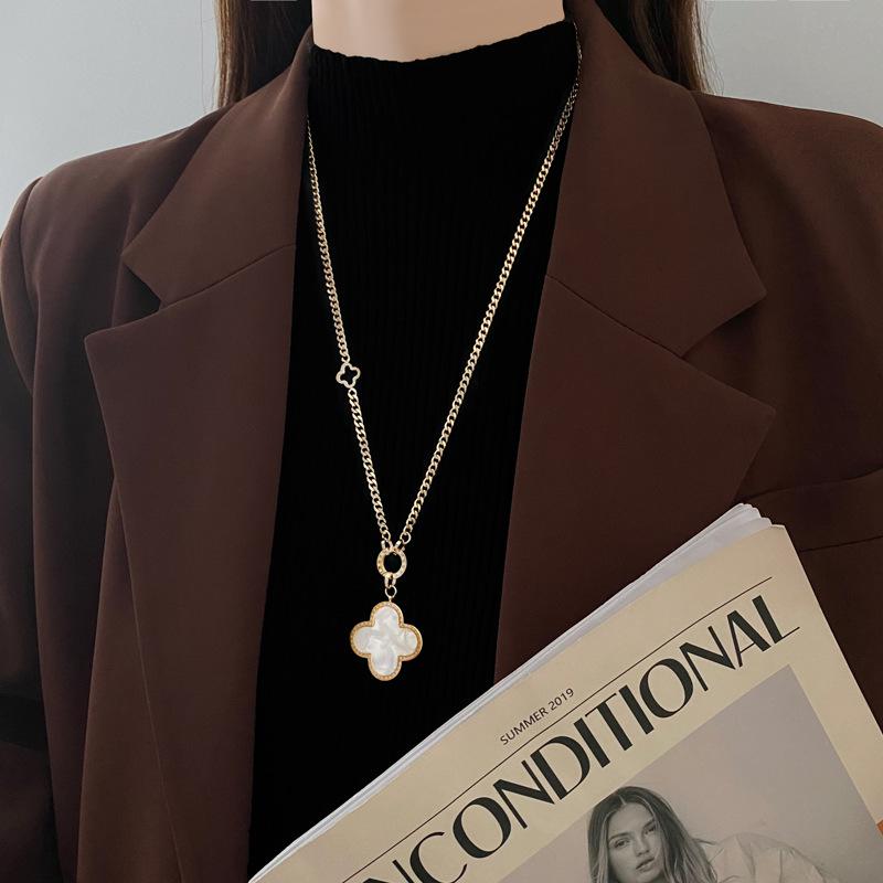 Stunning JMXD Titanium Steel Four Leaf Clover Pendant Sweater Chain Necklace High End Elegant Womens Fashion Jewelry Lucky Charm Gift Idea