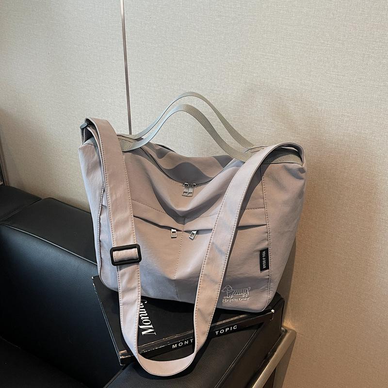 

Lazy wind large-capacity bag women s new versatile shoulder messenger bag casual commuter dumpling bag серый