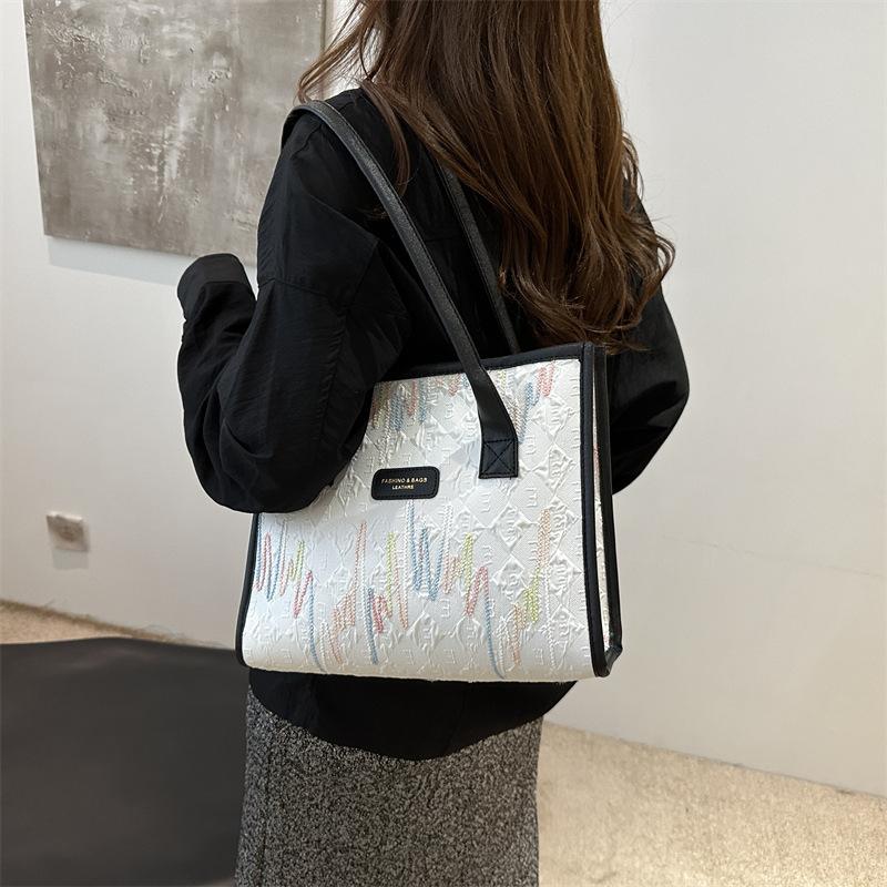 Stylish portable shoulder bag, commuting beautiful large-capacity canvas bag, simple 2025 new women's bag, foreign style tote bag