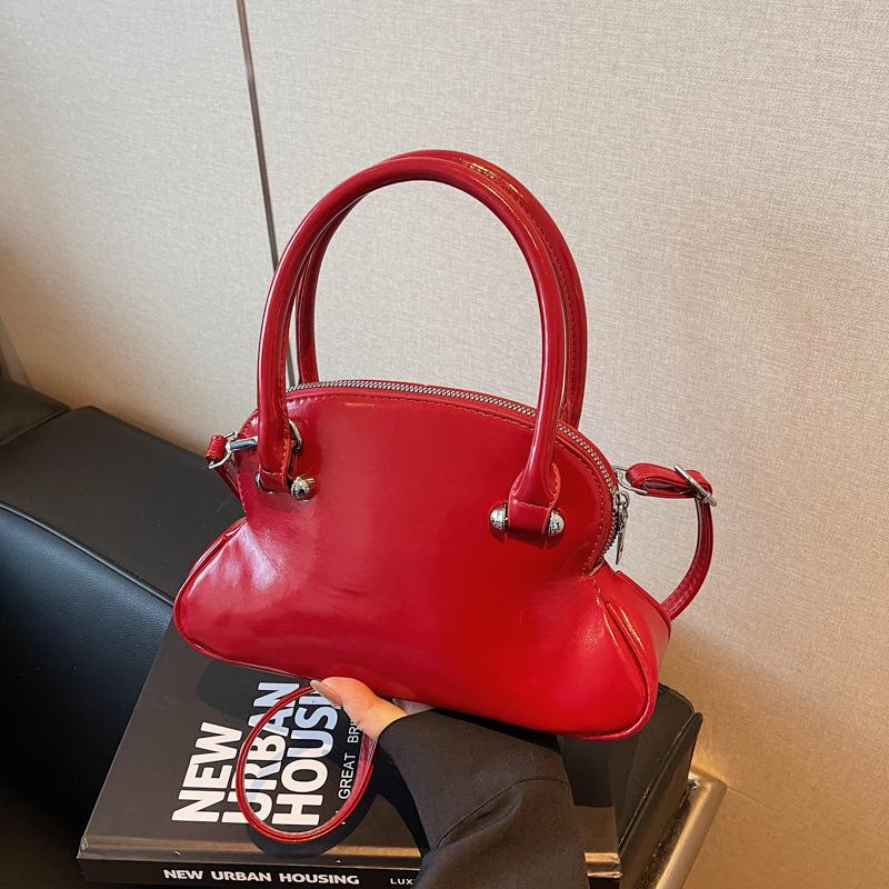 

Премиальная нишевая сумка с чувством, женская весна-лето 2025, новая модная простая сумка-мессенджер, женская портативная сумка-боулинг бордовый