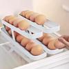 Slide-Out Double-Layer Egg Storage Box with Auto Roller and Anti-Fall for Fridge Door or Countertop.