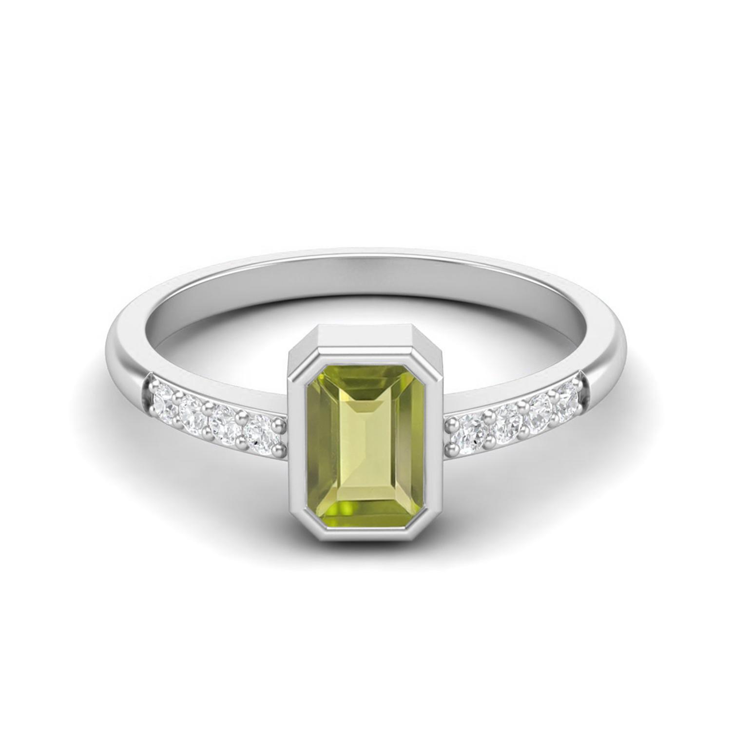 

Жіноча обручка-солітер з перидотом огранки «смарагд» 0,82 карата, виготовлена зі стерлінгового срібла 925 проби 12 білий