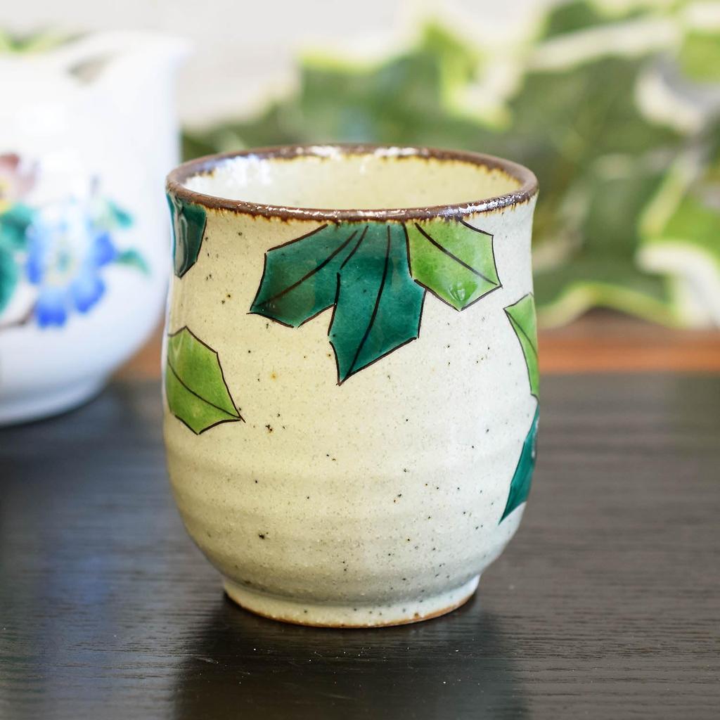 Stylish Kutani Ware Teacup Featuring a White Camellia and Bird Design. Made In Japan. A Brand of Ceramic.