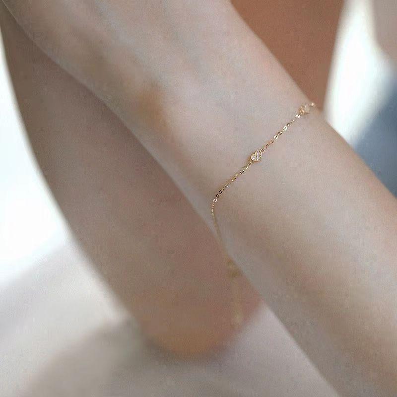 Japanese S925 Sterling Silver Heart-Shaped Bracelet with 14k Gold Plating, Featuring Three Small Cold Style Hearts. Simple and Elegant Design.