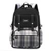 New schoolbag for primary school students, plaid load-reducing ridge backpack, anti-splashing water and wear-resistant canvas backpack, fashionable.